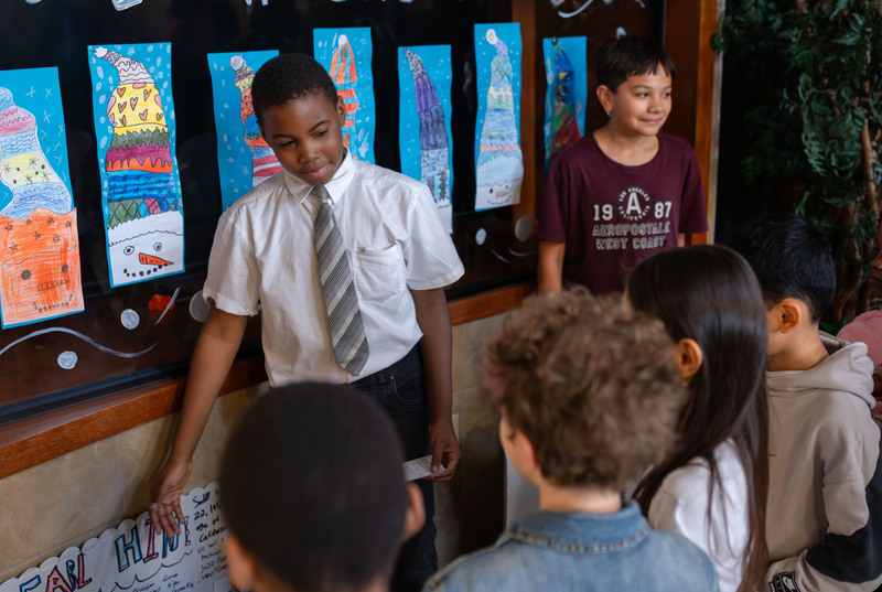 boys giving presentations to classmates