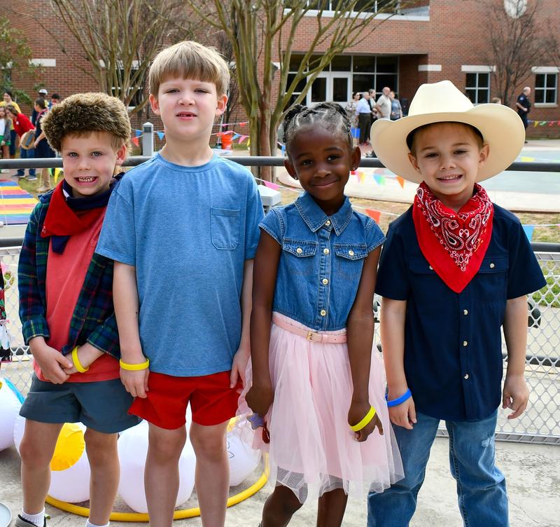 elementary kids in cowboy hats and boots