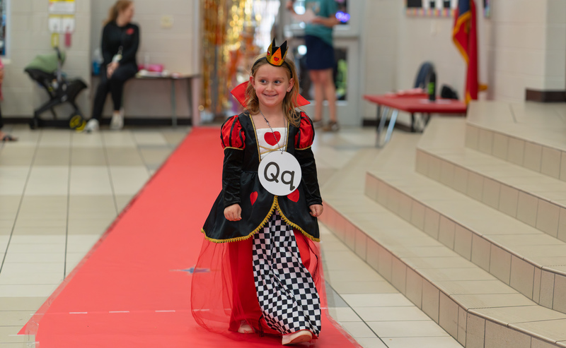 young girl dressed up like a queen