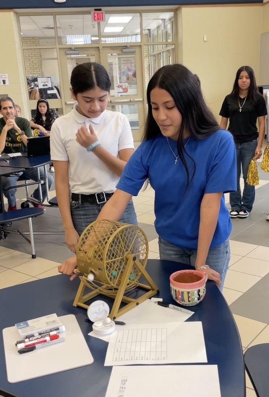 elementary girls spinning bingo wheel