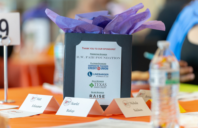 table centerpiece with gift bag and table numbers