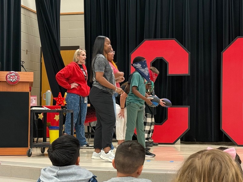 students holding awards