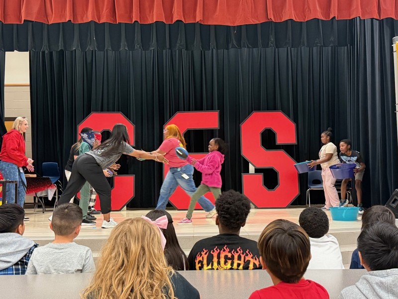 students holding awards