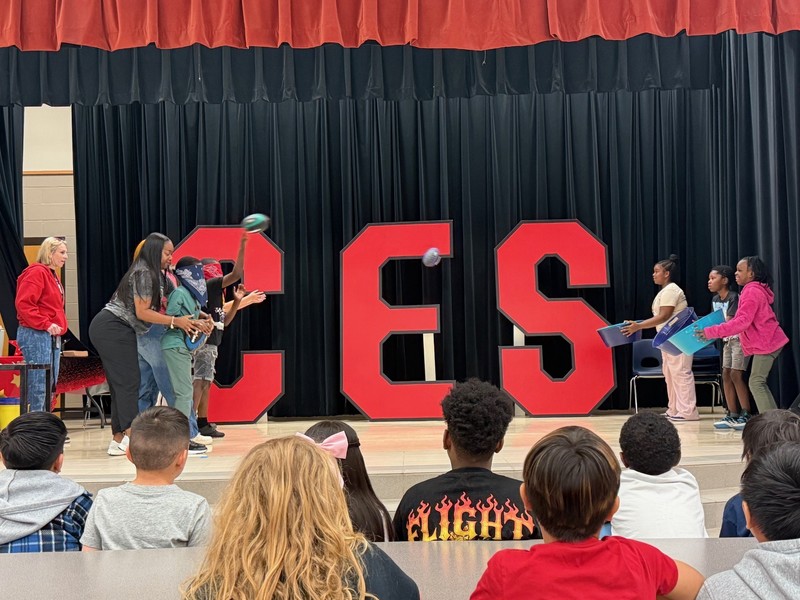 students holding awards