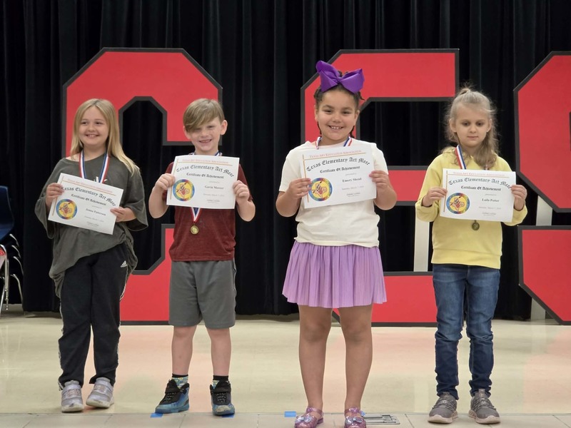 students holding awards