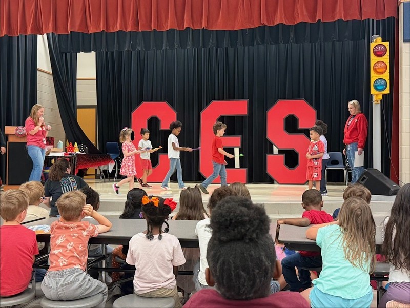 students holding awards