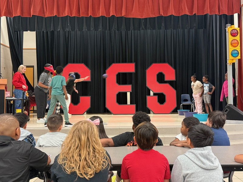 students holding awards