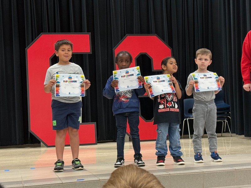 students holding awards