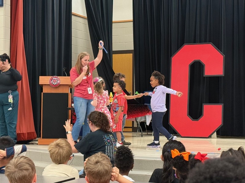 students holding awards