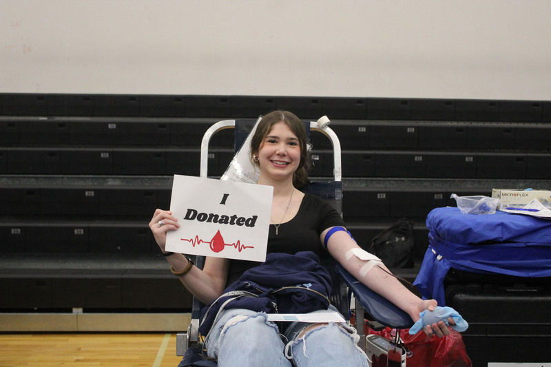 teen girl donating blood
