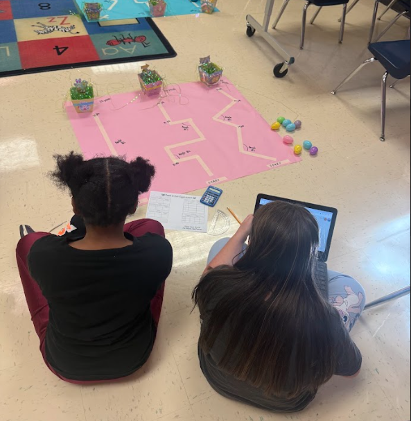 students navigating robot down path
