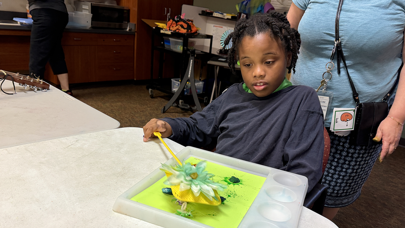 Student doing art