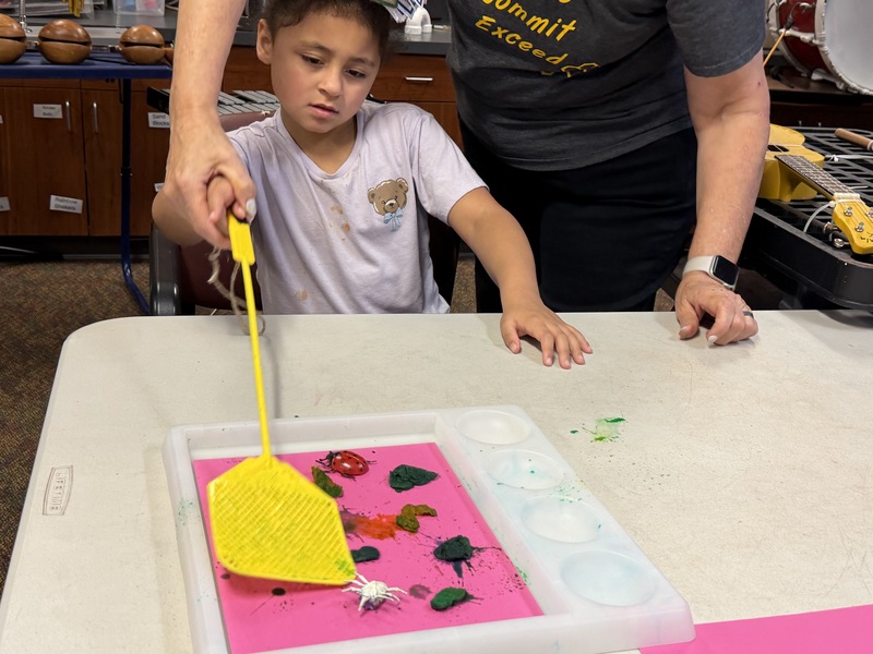 Student doing art