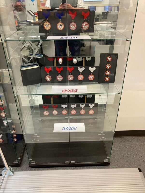 trophy case with medals and ribbons