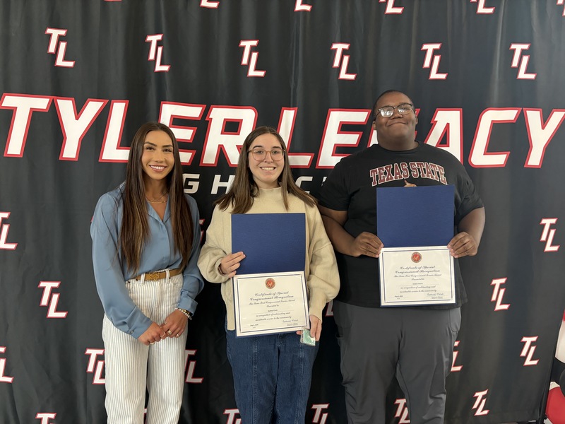 Reprensentative from Nathaniel Morna's office with congressional medal of honor: Sydney Cook  and Jordan Harris