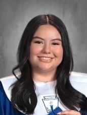 teen girl in graduation gown with white stole