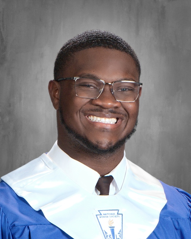 teen boy wearing blue graduation gown with white stole