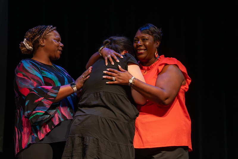 two women hugging each other