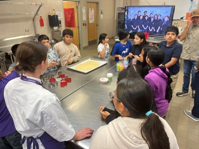 elementary kids making cookies in commercial kitchen