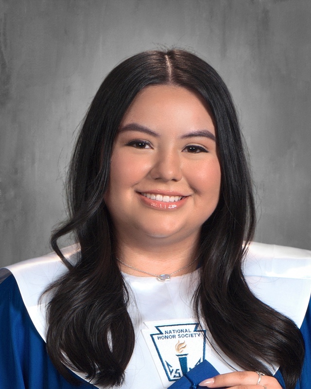 teen girl in graduation gown with white stole