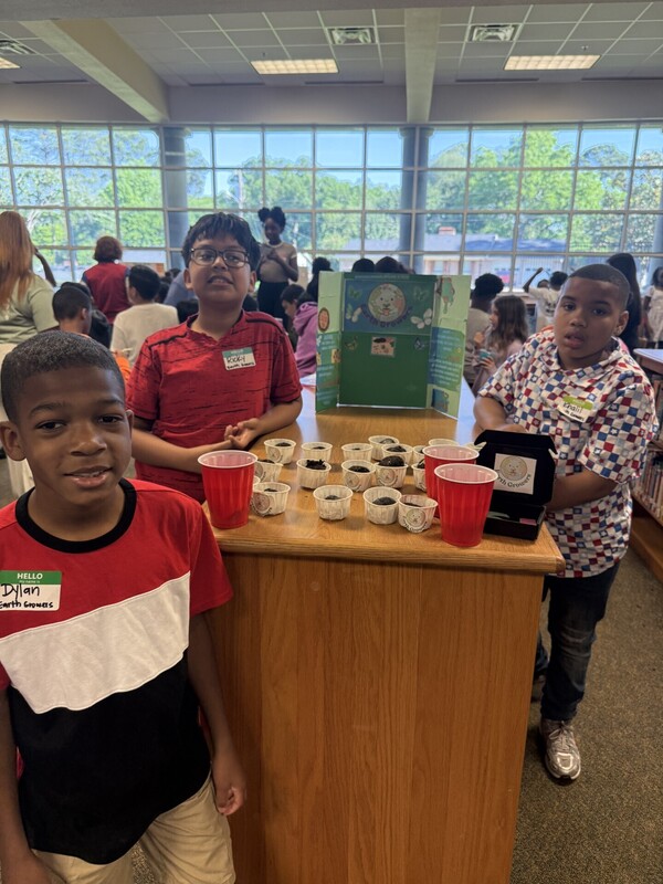 students standing with their business and merchandise