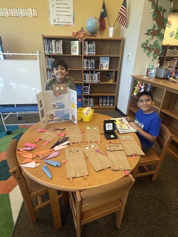 students standing with their business and merchandise