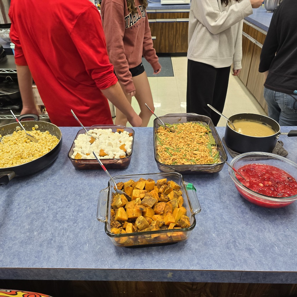 Green bean casserole,  sweet potatoes both savory and yam-like, cheesy corn 