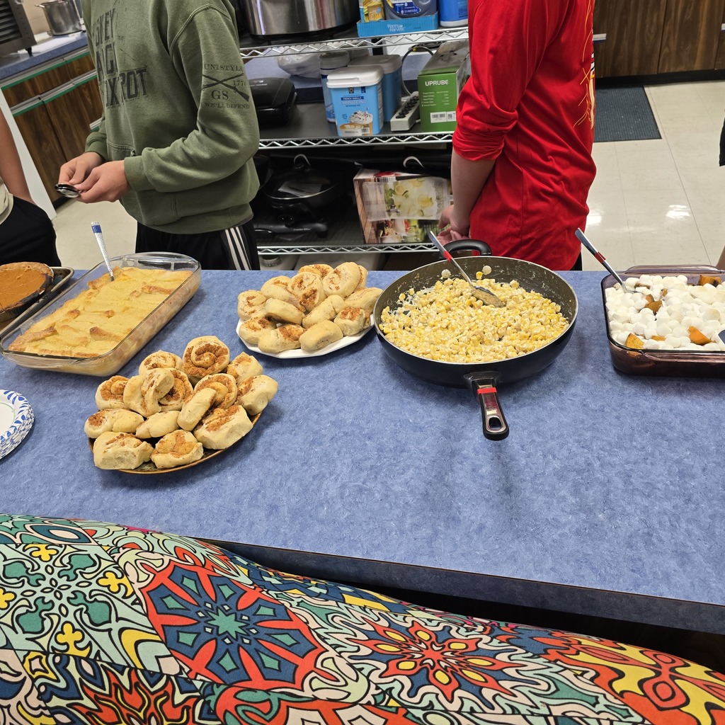 garlic parmesan rolls, peach cobbler, pumpkin pie, whipped cream