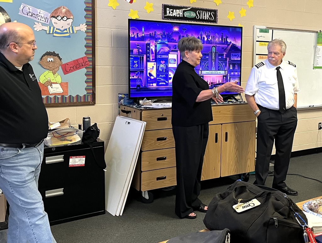 Flight attendant speaking to the class.