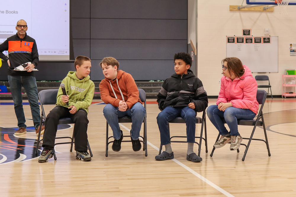 CVI's 6th grade team, Rainbow Mambas, deliberating over their answer