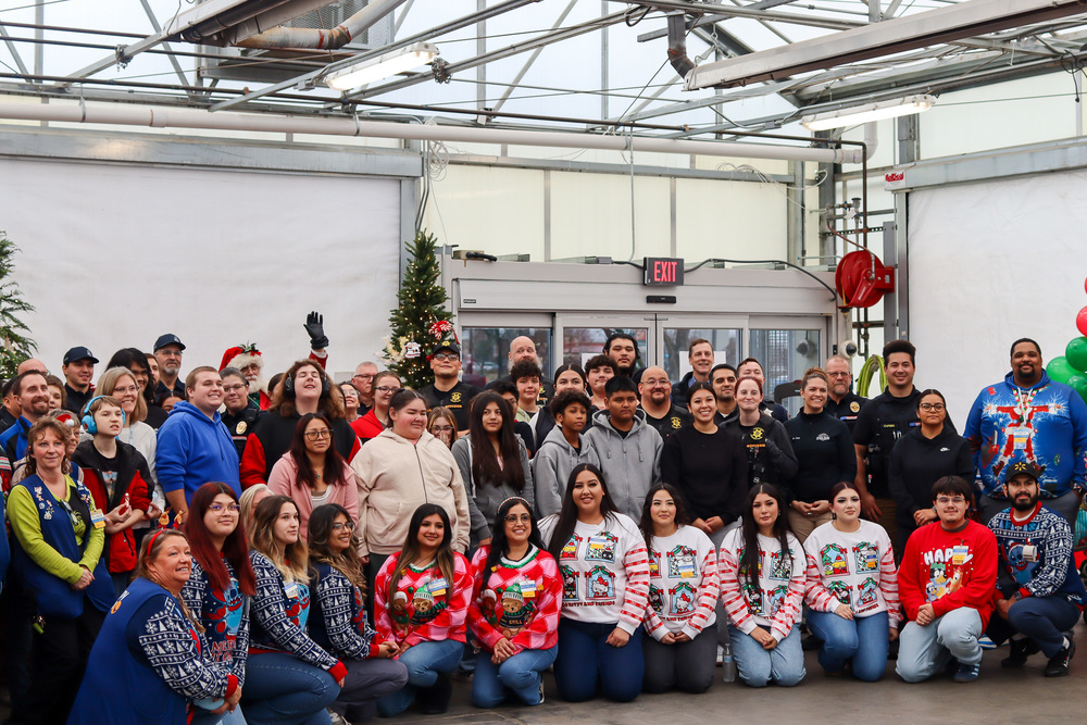 Group photo of students police officers and Walmart staff