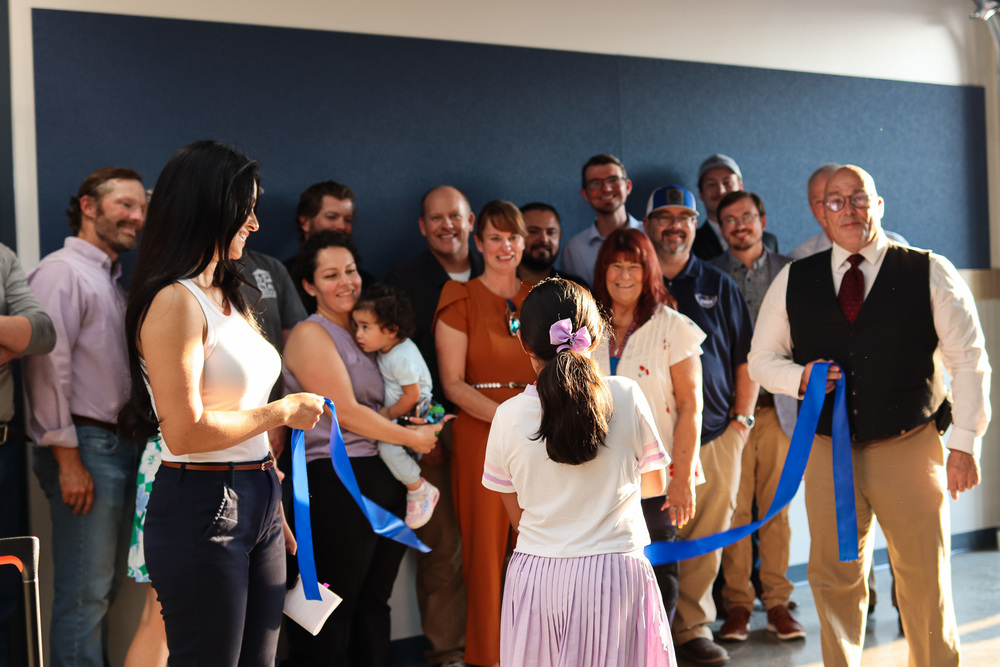 student cutting the ribbon at the CVI ribbon cutting ceremony