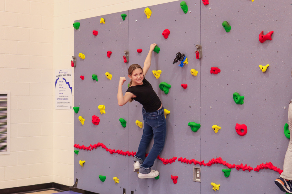 Photo of student climbing the rock wall