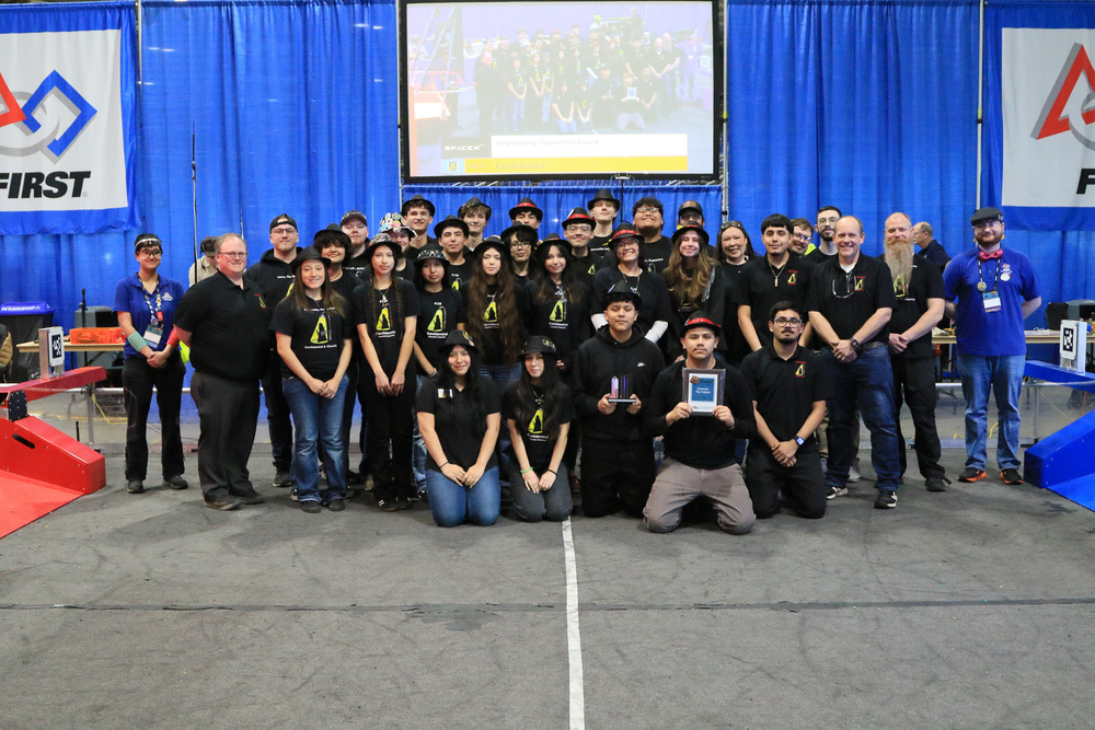 The team pictured at the PNW District Oregon State Fair event with their Engineering Inspiration Award.