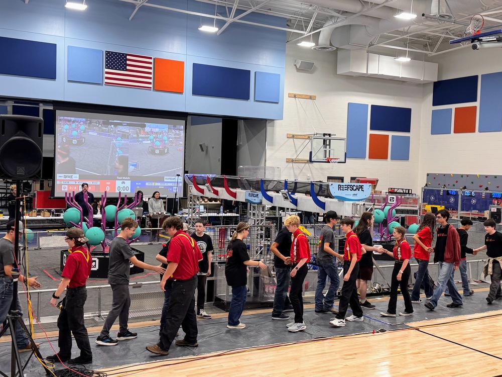 Teams shaking hands after competition