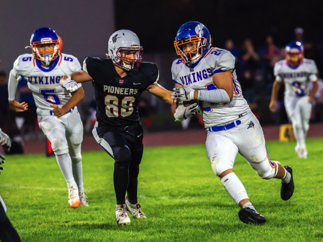 Photo by Kathy Aney Umatilla's Linkin Zamudio (24) runs the ball and attempts to evade Mac-Hi defender Masyn Lindsey (88) on Sept. 19, 2025, in Milton-Freewater.