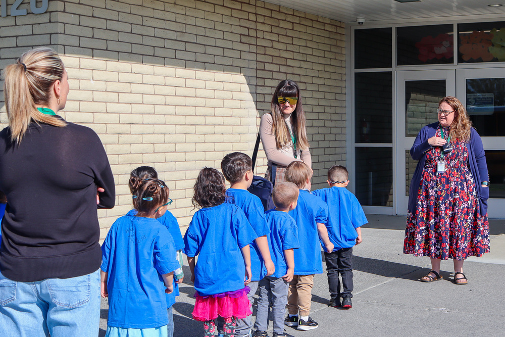 Photo of Principal Coyle welcoming Head Start students