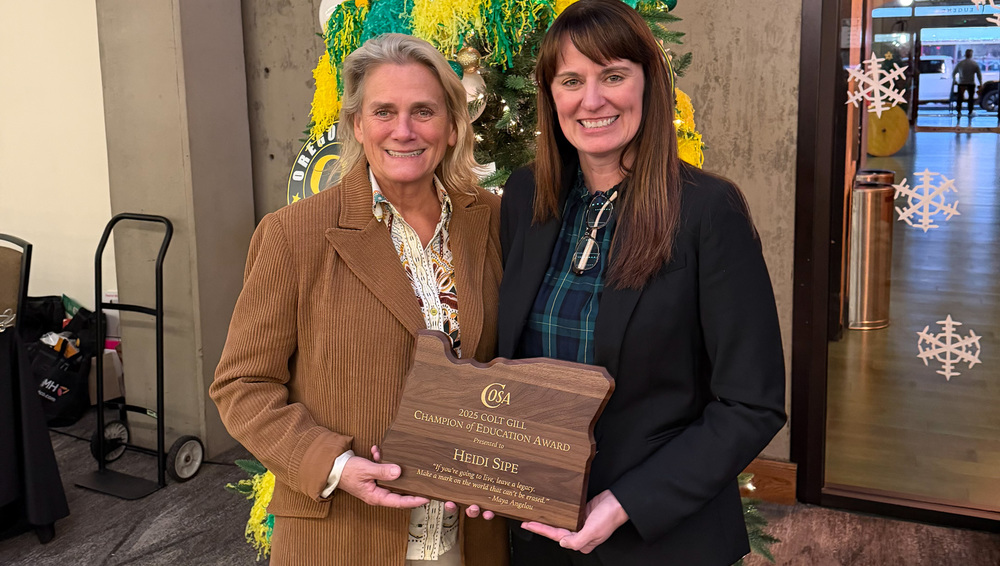 Superintendent Heidi Sipe (right) is presented with the 2025 COSA Colt Gill Champion of Education Award by COSA Executive Director Dr. Krista Parent (left).