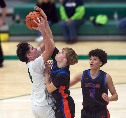 Photo by Kathy Aney As Pendleton’s Jubal Hoisington goes up to shoot, Umatilla's Bryce Morris gets a hand on the ball on Jan. 26, 2026, at Warberg Court.