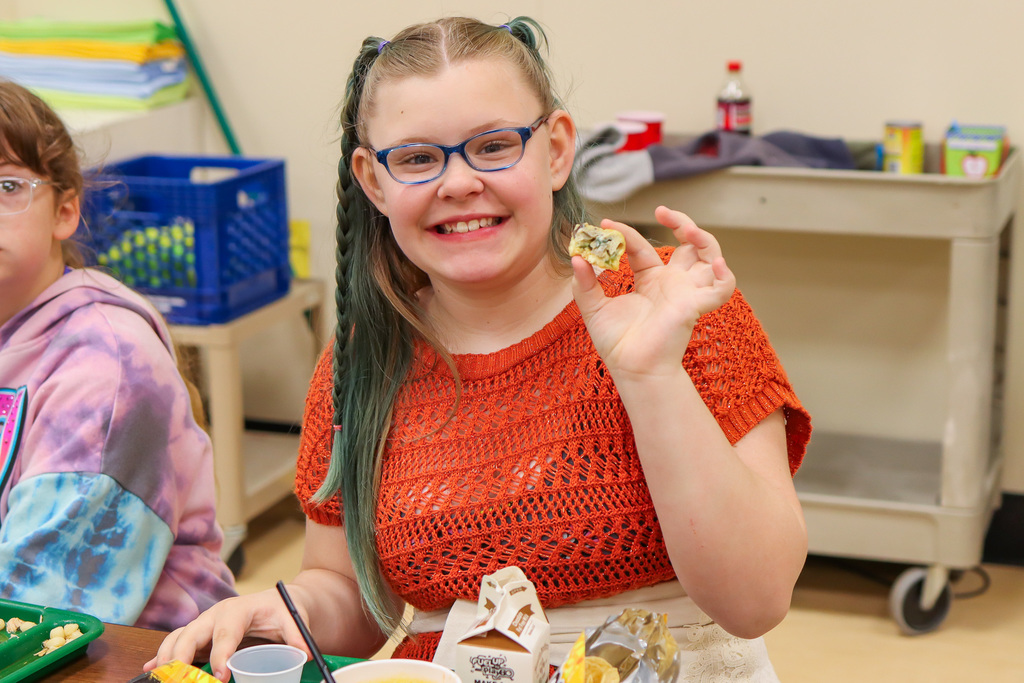 student with Frittata sample