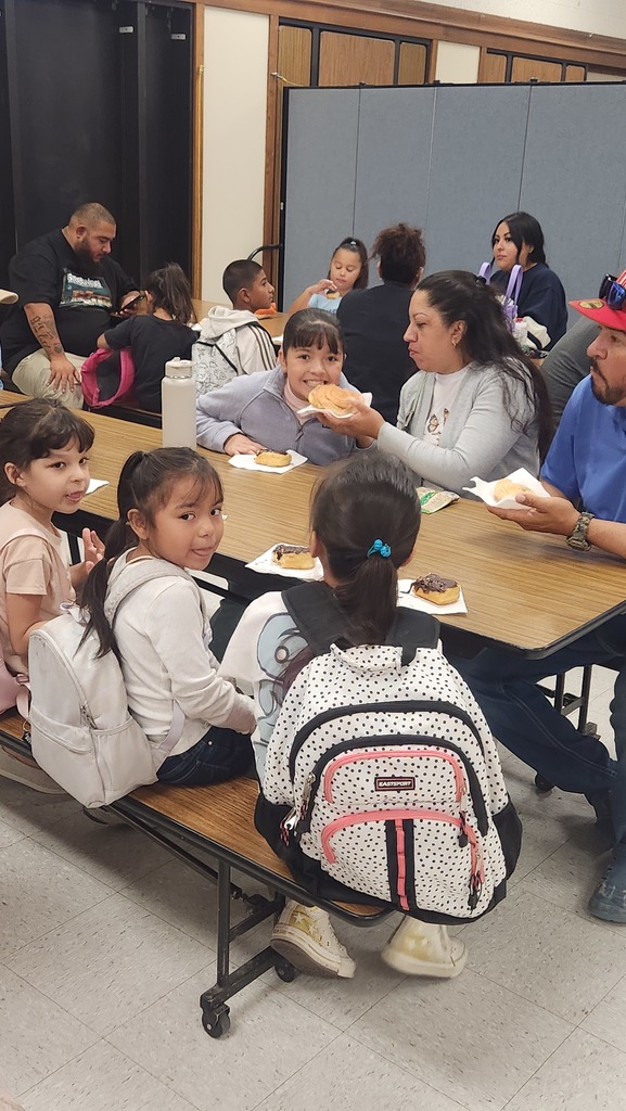 student and family enjoying donuts