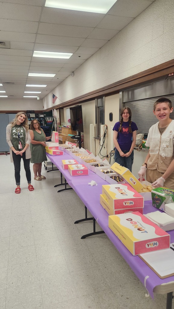 staff ready to hand out donuts 