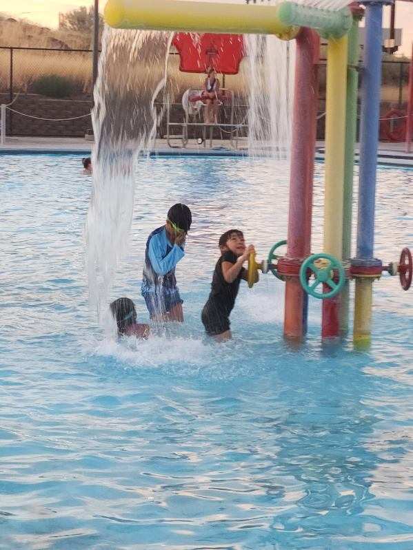 Students having fun at the end of the year summer school pool party