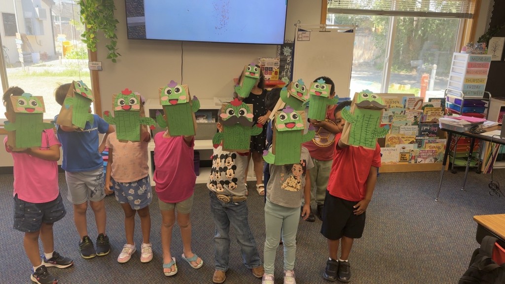 Students holding up their craft project