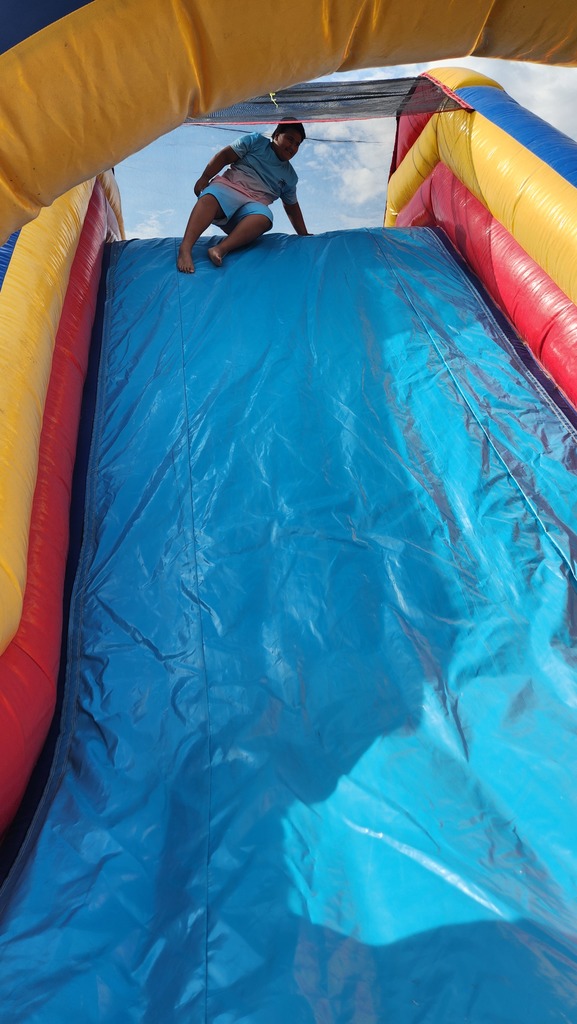 Students going down the inflatable slide