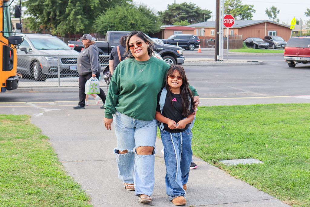 Parent walking student to school