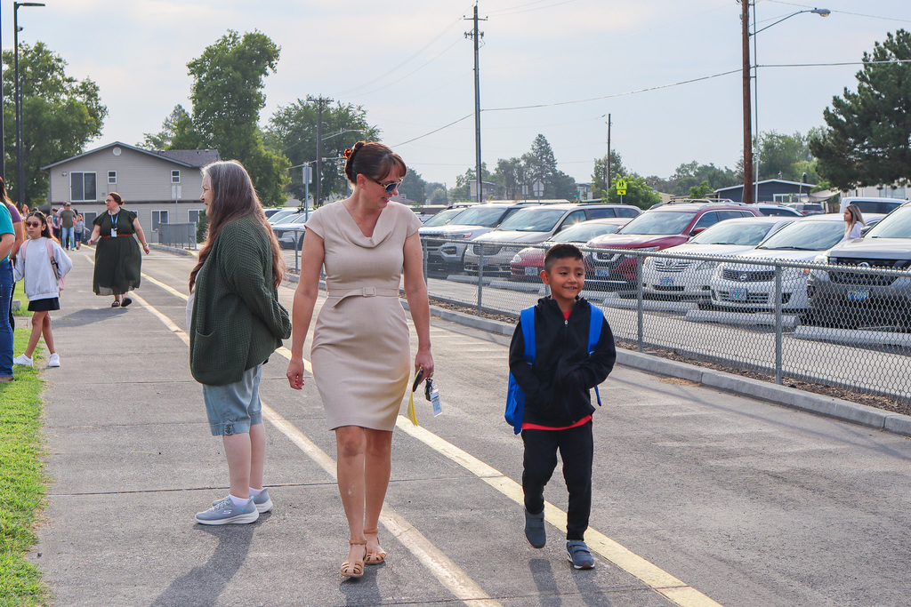 Superintendent Sipe welcoming student to school