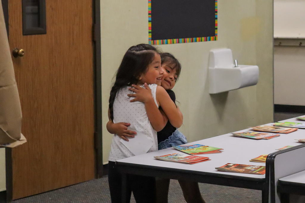 students hugging