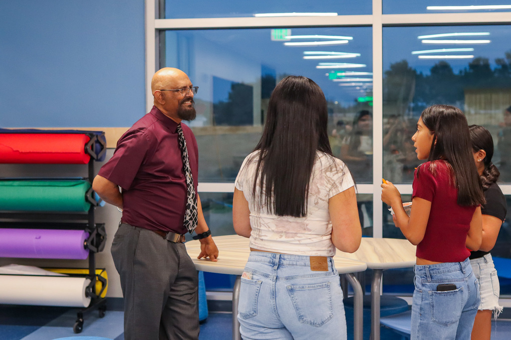 students and families visiting with teacher