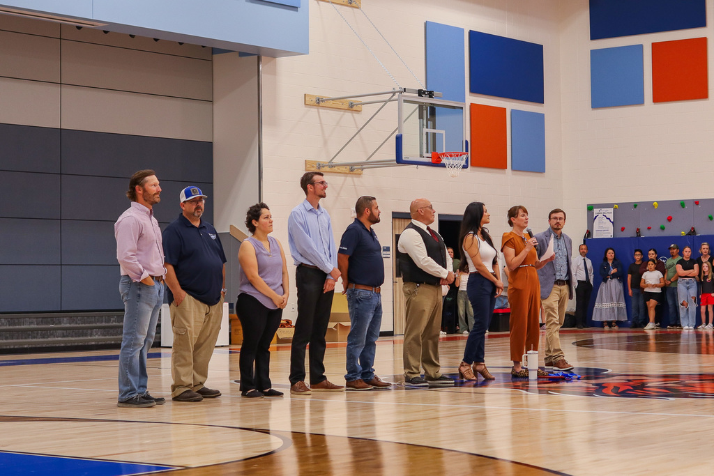 Superintendent Sipe giving speech at ceremony with school board